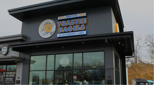 Storefront of a Toastee Bagels restaurant featuring the brand logo and “Jersey Style” signage.